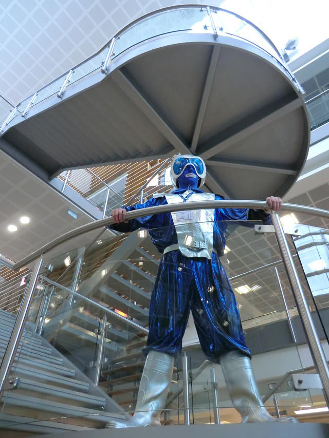 Andrew in a blue and silver spacesuit